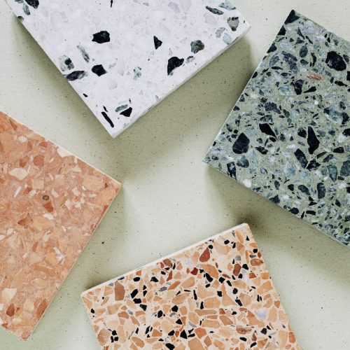 Colorful granite cubes on background